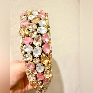 Baroque-style padded headband with multi-colored rhinestones.